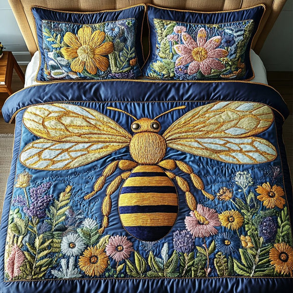 Honeybee Garden Glow quilted 3-piece bedding set on a made bed with two matching pillow shams