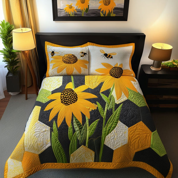 Honeyed Blooms quilted 3-piece bedding set on a made bed with two matching pillow shams