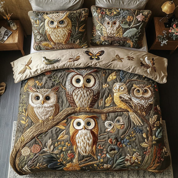 Hoot Dreams quilted 3-piece bedding set on a made bed with two matching pillow shams