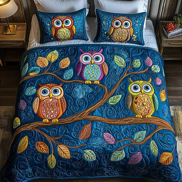 Hoot Haven quilted 3-piece bedding set on a made bed with two matching pillow shams