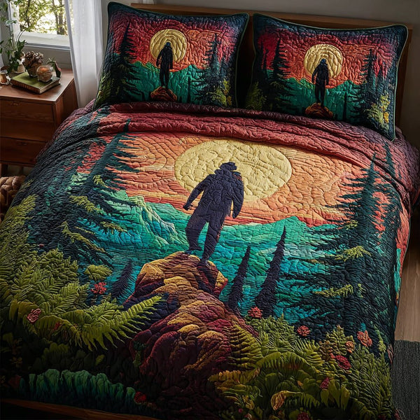 Horizon Hiker quilted 3-piece bedding set on a made bed with two matching pillow shams