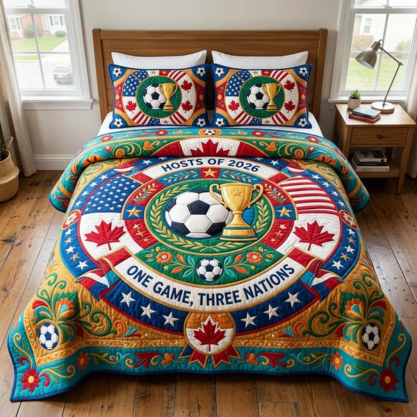 Host Pride quilted 3-piece bedding set on a made bed with two matching pillow shams