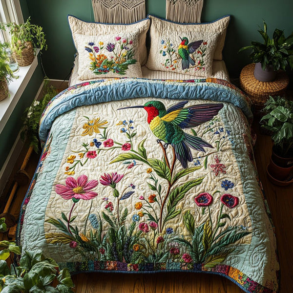 Hover Dance quilted 3-piece bedding set on a made bed with two matching pillow shams