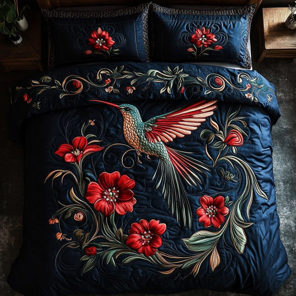 Hovering Grace quilted 3-piece bedding set on a made bed with two matching pillow shams