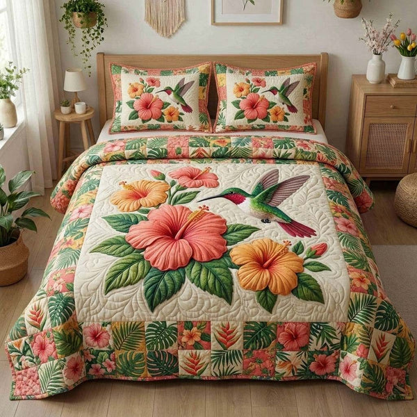 Humming Bloom quilted 3-piece bedding set on a made bed with two matching pillow shams