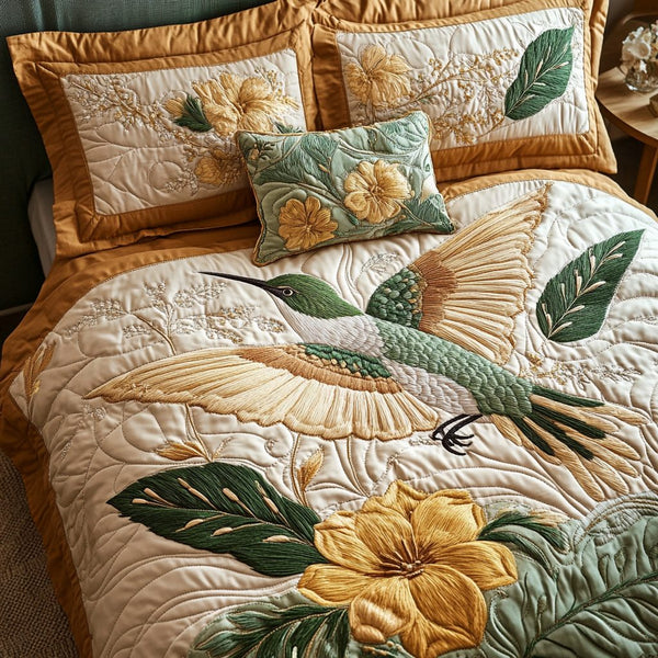 Humming Bloom quilted 3-piece bedding set on a made bed with two matching pillow shams