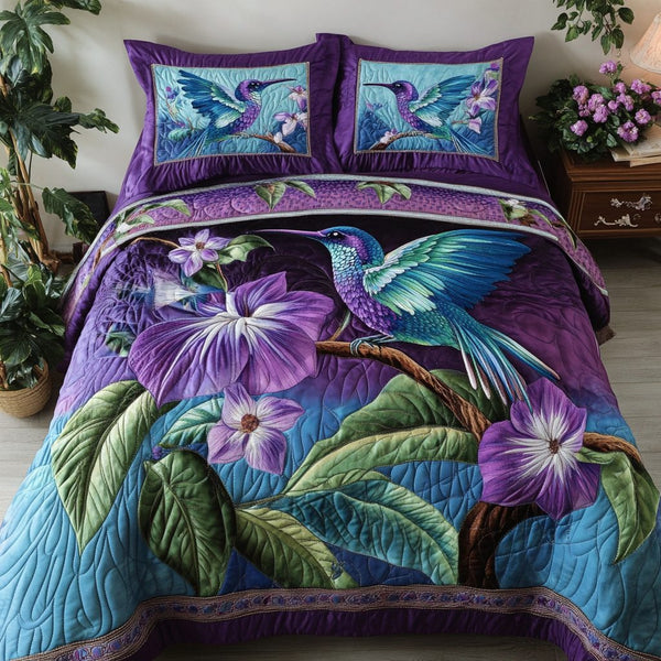 Humming Bloom quilted 3-piece bedding set on a made bed with two matching pillow shams