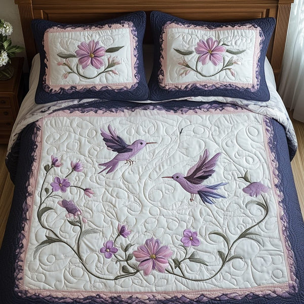Humming Harmony quilted 3-piece bedding set on a made bed with two matching pillow shams