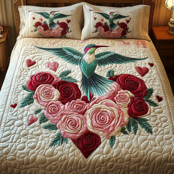 Humming Heart quilted 3-piece bedding set on a made bed with two matching pillow shams