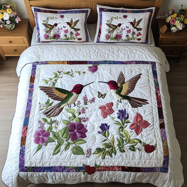 Humming Love quilted 3-piece bedding set on a made bed with two matching pillow shams
