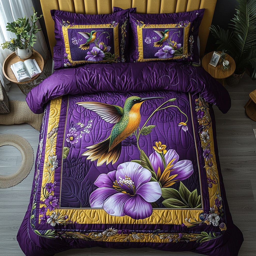 Hummingbird Bliss quilted 3-piece bedding set on a made bed with two matching pillow shams