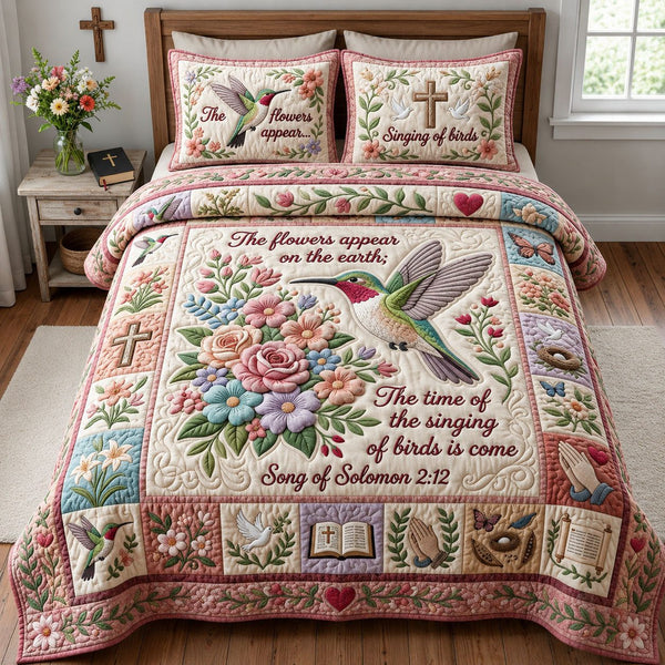 Hummingbird Floral Christian quilted 3-piece bedding set on a made bed in a softly lit bedroom