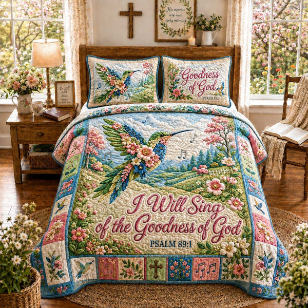 Hummingbird Garden Praise quilted 3-piece bedding set on a made bed with two matching pillow shams