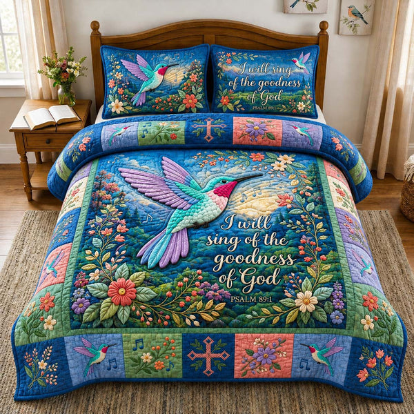 Hummingbird Goodness Song quilted 3-piece bedding set on a made bed with two matching pillow shams