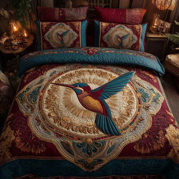 Hummingbird Heaven quilted 3-piece bedding set on a made bed in a softly lit bedroom