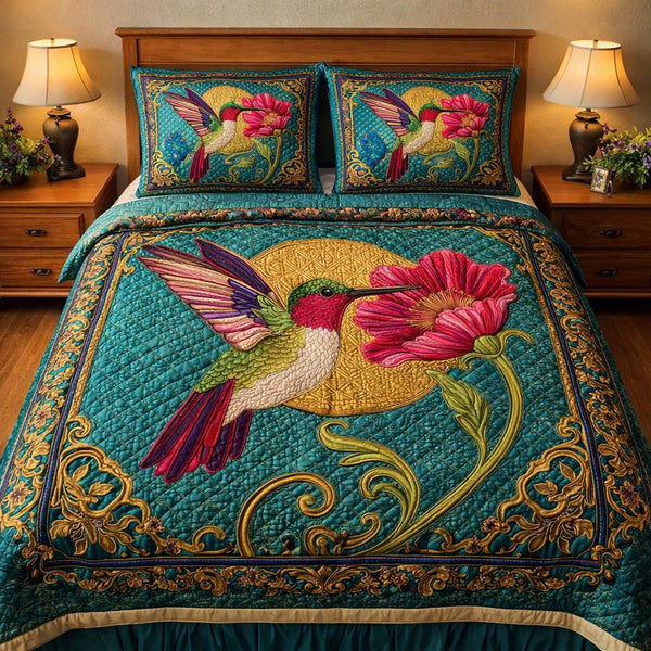 Hummingbird Heaven quilted 3-piece bedding set on a made bed in a softly lit bedroom