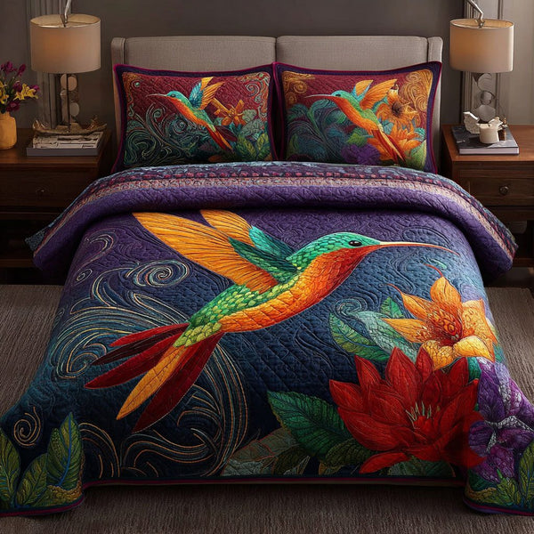 Hummingbird Light quilted 3-piece bedding set on a made bed with two matching pillow shams