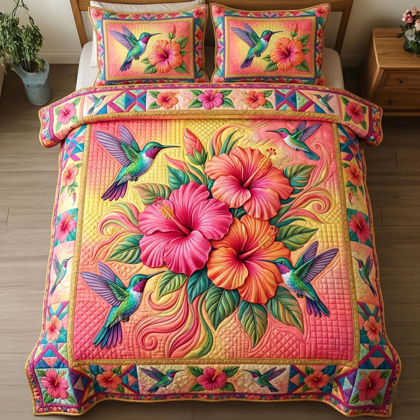Hummingbird of Hope quilted 3-piece bedding set on a made bed with two matching pillow shams