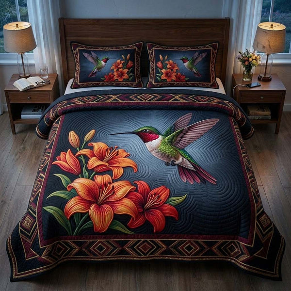 Hummingbird quilted 3-piece bedding set on a made bed with two matching pillow shams
