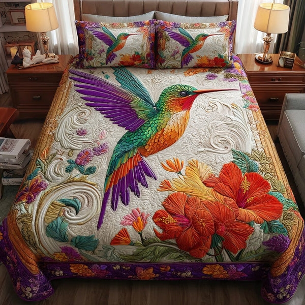 Hummingbird Song quilted 3-piece bedding set on a made bed with two matching pillow shams