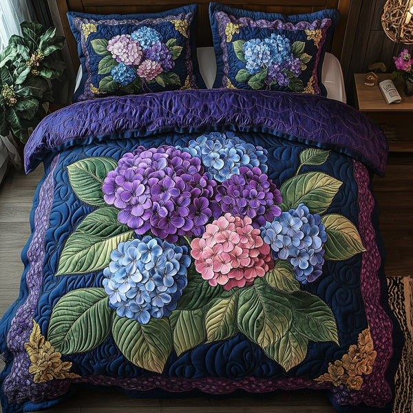 Hydrangea Bloom Elegance quilted 3-piece bedding set on a made bed with two matching pillow shams