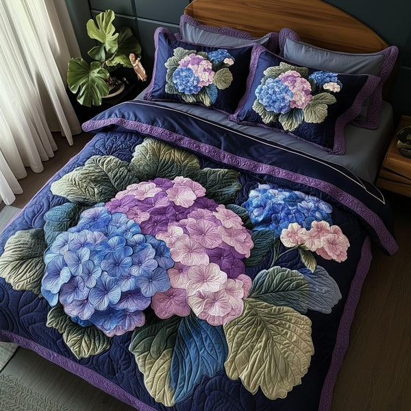 Hydrangea Bloom quilted 3-piece bedding set on a made bed with two matching pillow shams