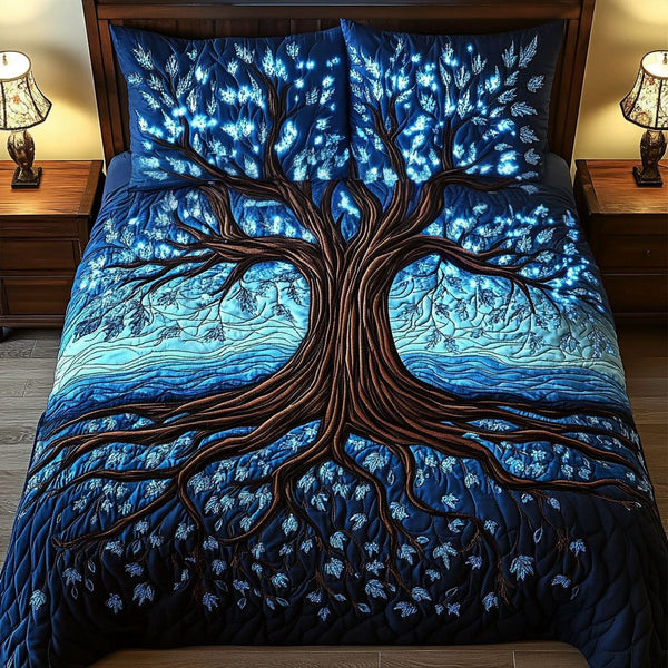 Illuminated Night Tree quilted 3-piece bedding set on a made bed with two matching pillow shams