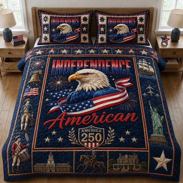 Independence America quilted 3-piece bedding set on a made bed in a warmly lit bedroom