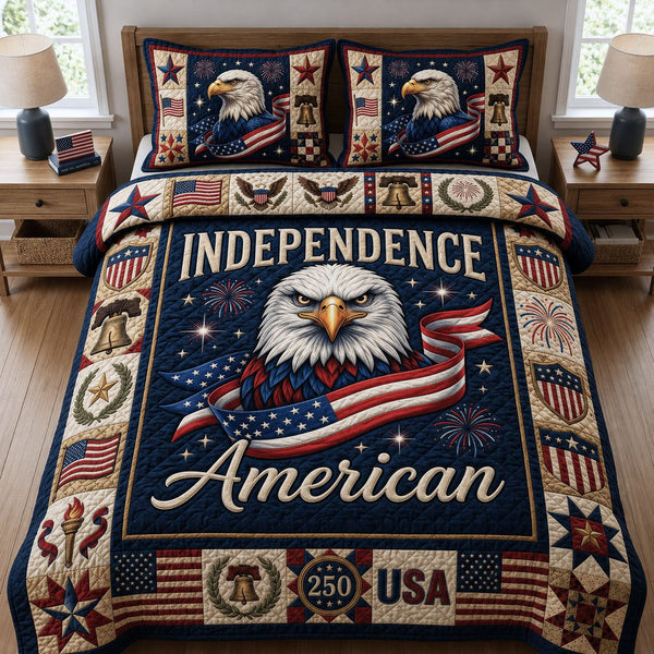 Independence America quilted 3-piece bedding set on a made bed in a warmly lit bedroom