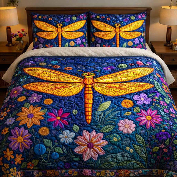 Indigo Bloom quilted 3-piece bedding set on a made bed with two matching pillow shams