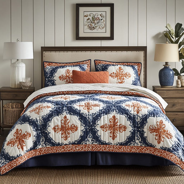 Indigo Charm quilted 3-piece bedding set on a made bed with two matching pillow shams