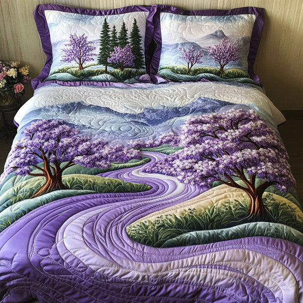 Indigo Rise quilted 3-piece bedding set on a made bed with two matching pillow shams