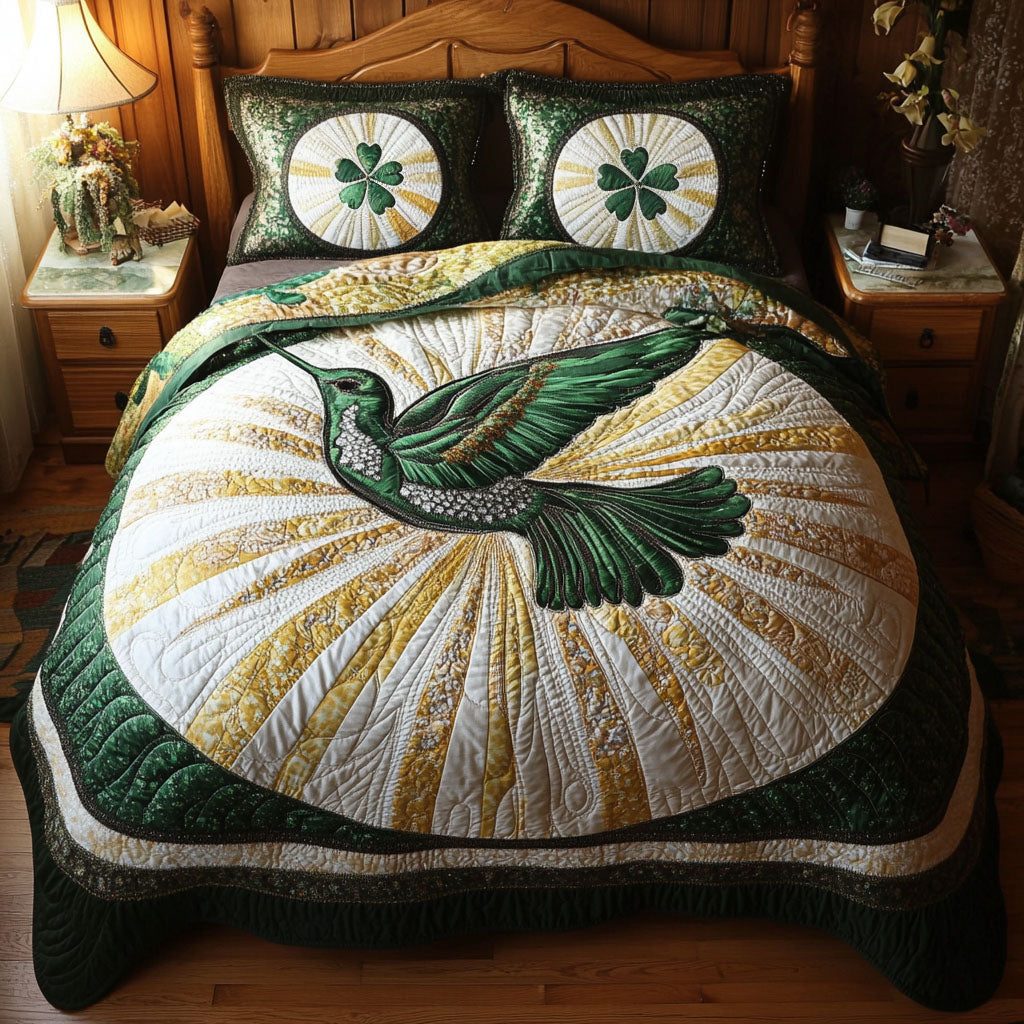 Infinite Grace quilted 3-piece bedding set on a made bed with two matching pillow shams