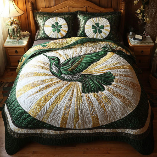 Infinite Grace quilted 3-piece bedding set on a made bed with two matching pillow shams