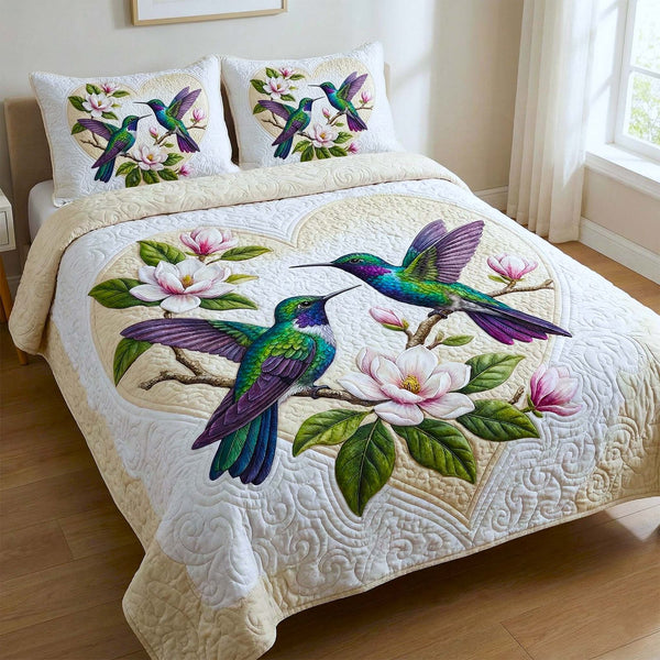 Iridescent Drift quilted 3-piece bedding set on a made bed with two matching pillow shams