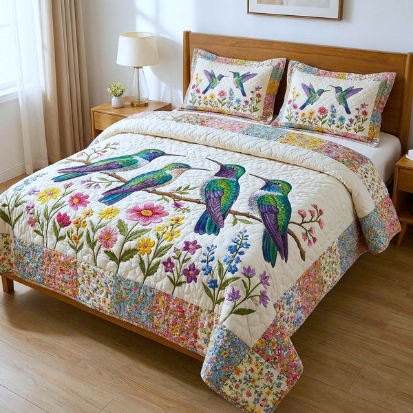 Iridescent Drift quilted 3-piece bedding set on a made bed with two matching pillow shams