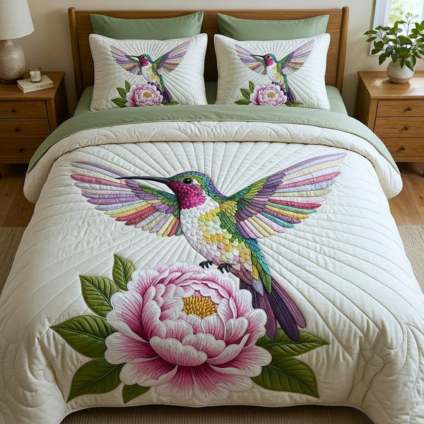 Iridescent Flutter quilted 3-piece bedding set on a made bed with two matching pillow shams