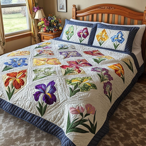 Iris Garden Patch quilted 3-piece bedding set on a made bed with two matching pillow shams
