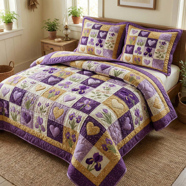 Iris Hearts quilted 3-piece bedding set on a made bed with two matching pillow shams