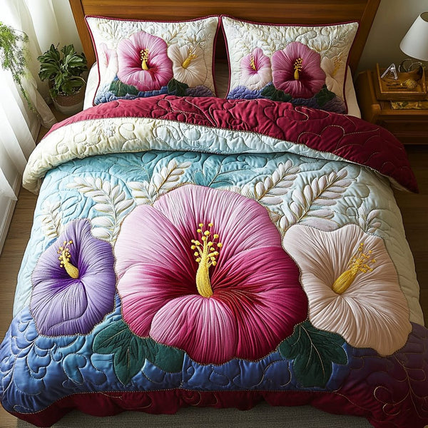Island Blossom quilted 3-piece bedding set on a made bed in a light coastal bedroom