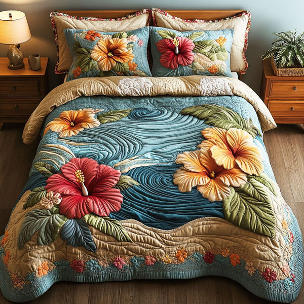 Island Hibiscus quilted 3-piece bedding set on a made bed in a light coastal bedroom