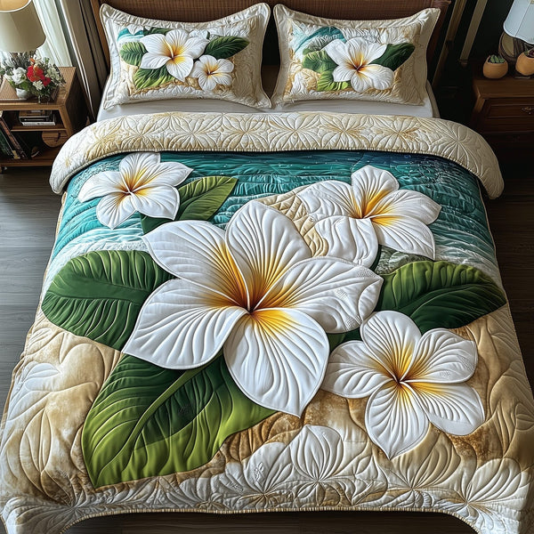 Island Plumera Paradise quilted 3-piece bedding set on a made bed in a light coastal bedroom