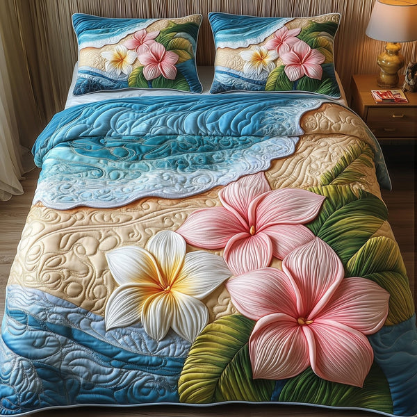 Island Plumera Paradise quilted 3-piece bedding set on a made bed in a light coastal bedroom