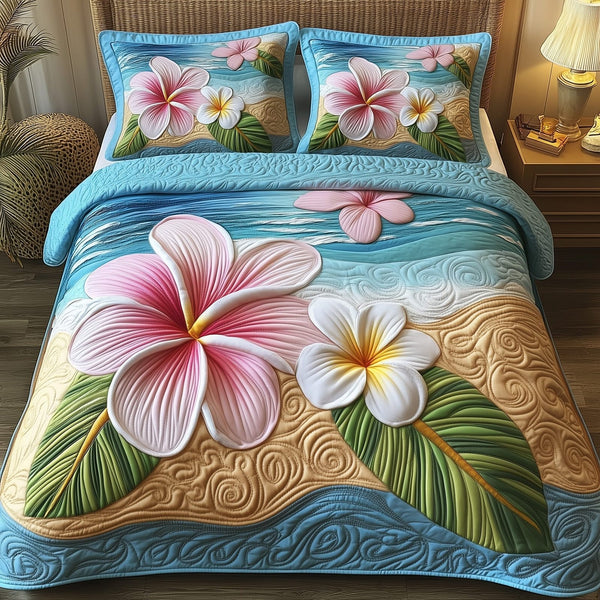 Island Plumera Paradise quilted 3-piece bedding set on a made bed in a light coastal bedroom