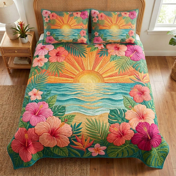 Island Sunrise quilted 3-piece bedding set on a made bed in a light coastal bedroom