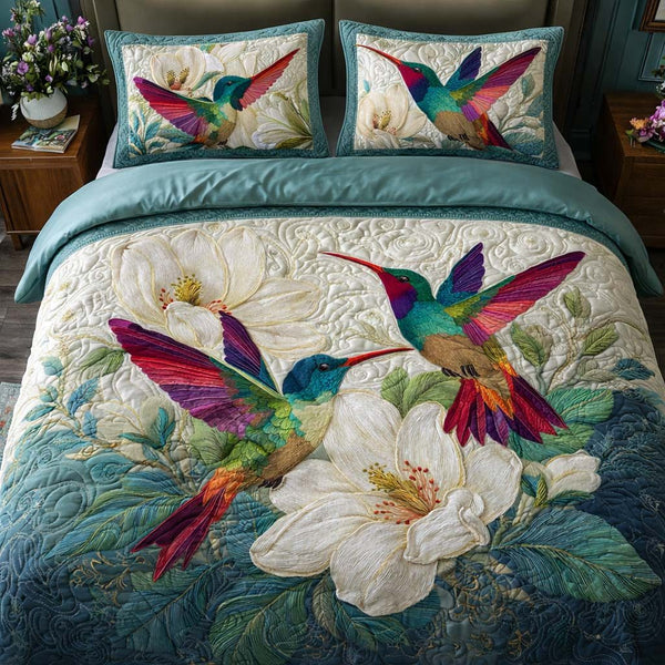 Ivory Garden quilted 3-piece bedding set on a made bed with two matching pillow shams