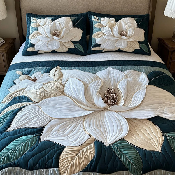 Ivory Garden quilted 3-piece bedding set on a made bed with two matching pillow shams
