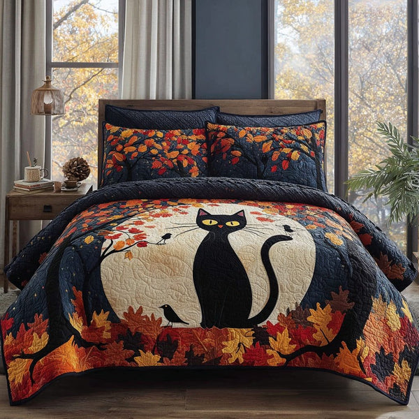 Jackolantern Kitty Snuggle quilted 3-piece bedding set on a made bed with two matching pillow shams