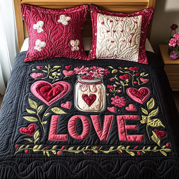 Jar of Love quilted 3-piece bedding set on a made bed with two matching pillow shams