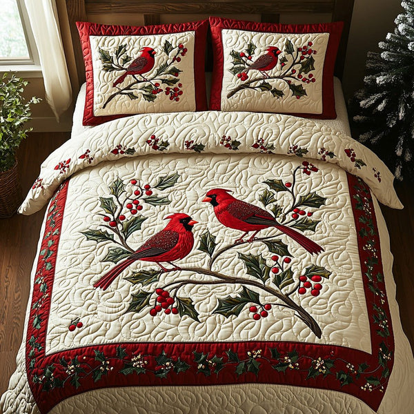 Jolly Cardinals quilted 3-piece bedding set on a made bed with two matching pillow shams